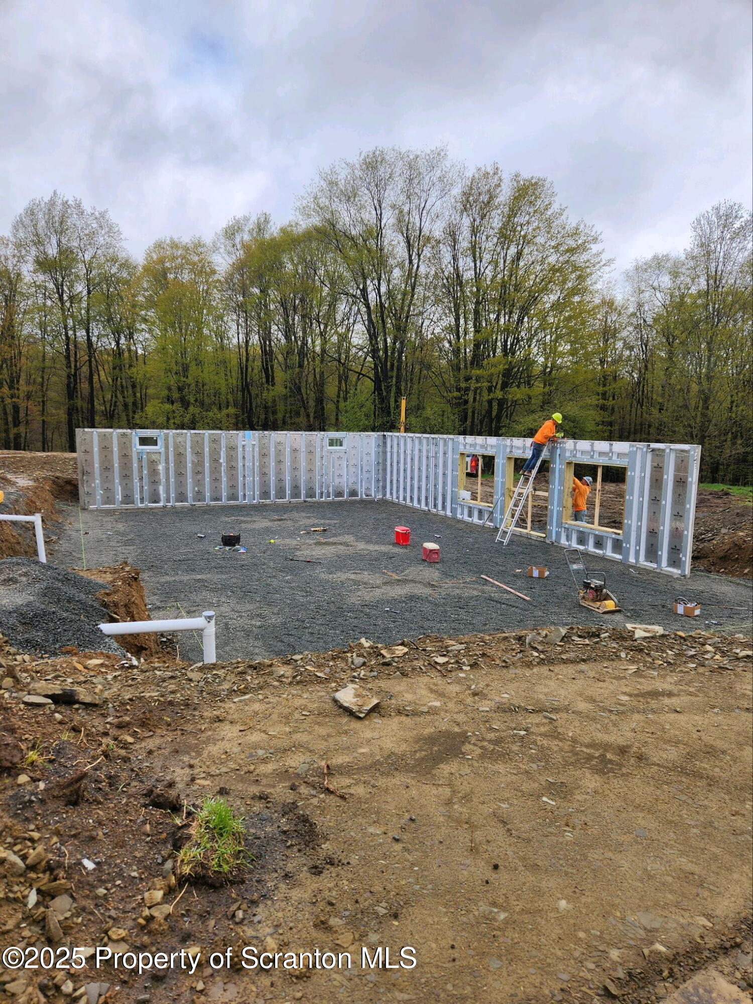 742 May Road Union Dale, PA 18470 - Photo 1 of 19 a view of backyard with large trees and wooden fence