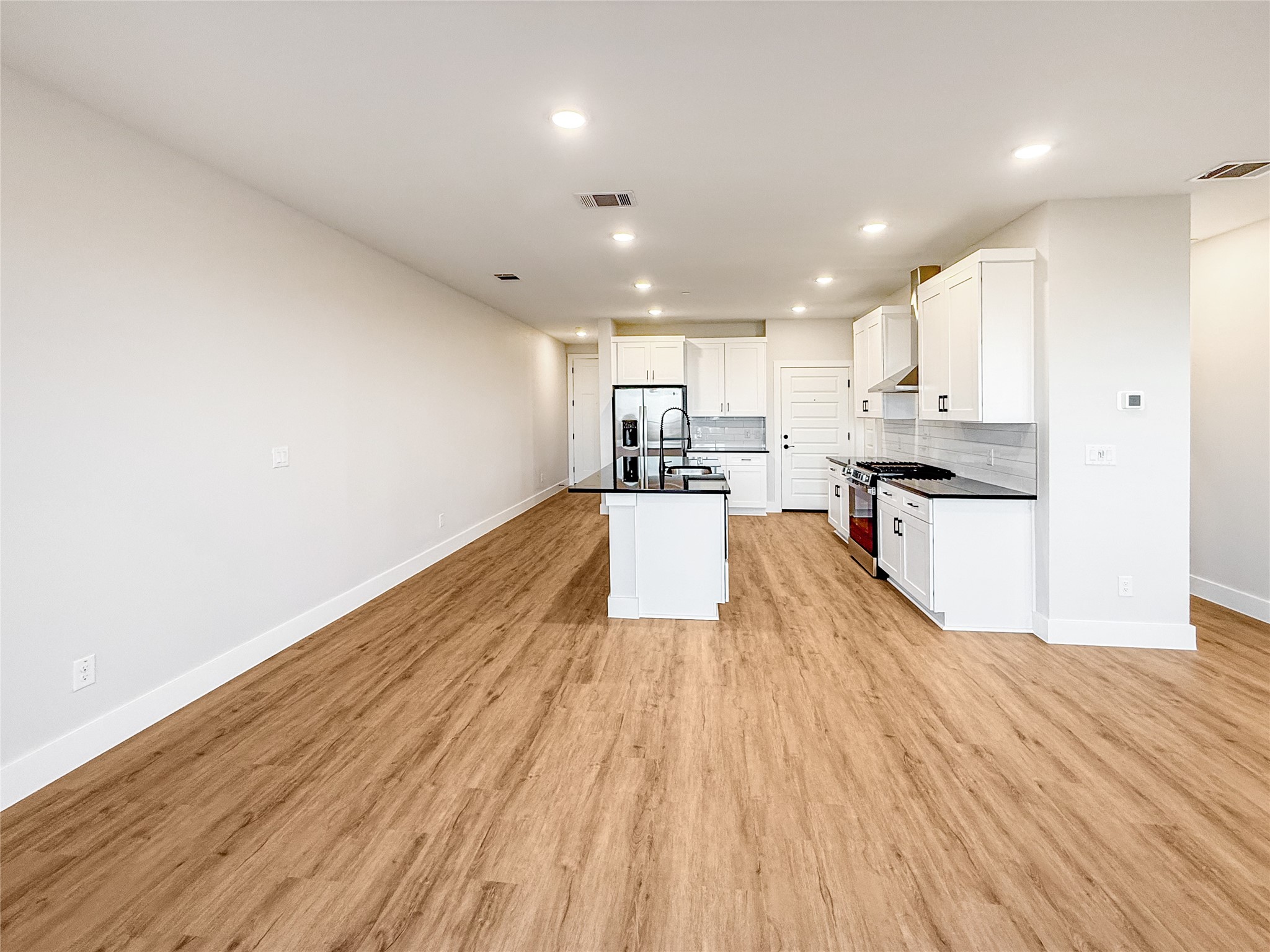 5607 Mobeetie Loop Bee Cave, TX 78738 - Photo 6 of 21 living room open to kitchen