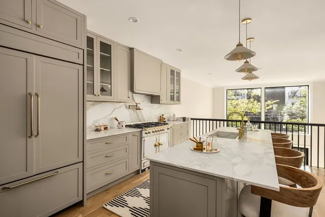 a living room with furniture and flowers