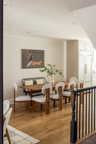 a kitchen with a stove and white cabinets
