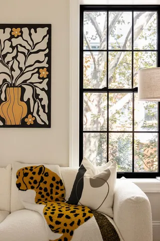 a living room with furniture and white walls