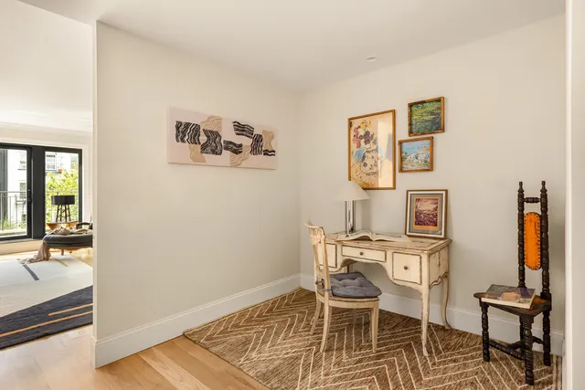 a bedroom with a bed and a night stand