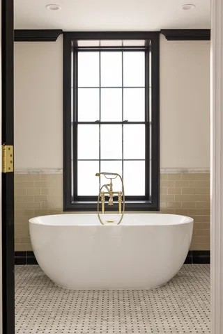 a bathroom with a shower and a tub