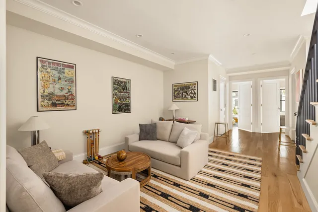 a bedroom with furniture and a large window