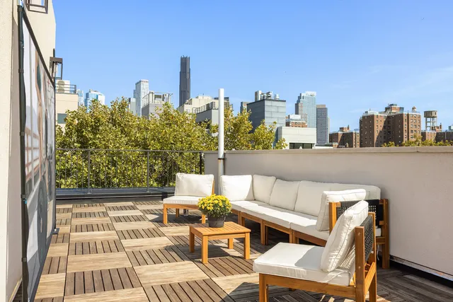 a view of staircase with railing and a rug