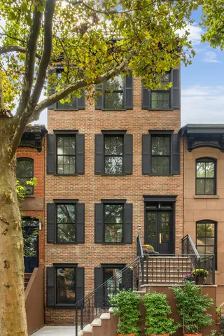 a view of a bedroom with a furniture and staircase