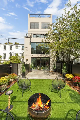 a table and chairs sitting in front of a building
