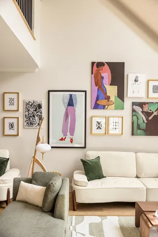 a view of a swimming pool with lawn chairs and plants