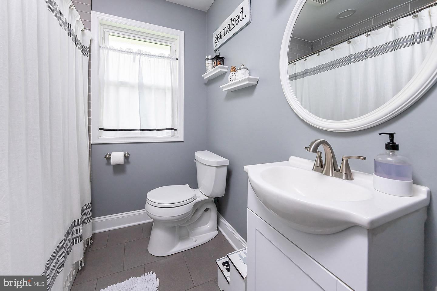 575 Allegheny Road Wenonah, NJ 08090 - Photo 13 of 23 a white toilet sitting next to a bathroom sink