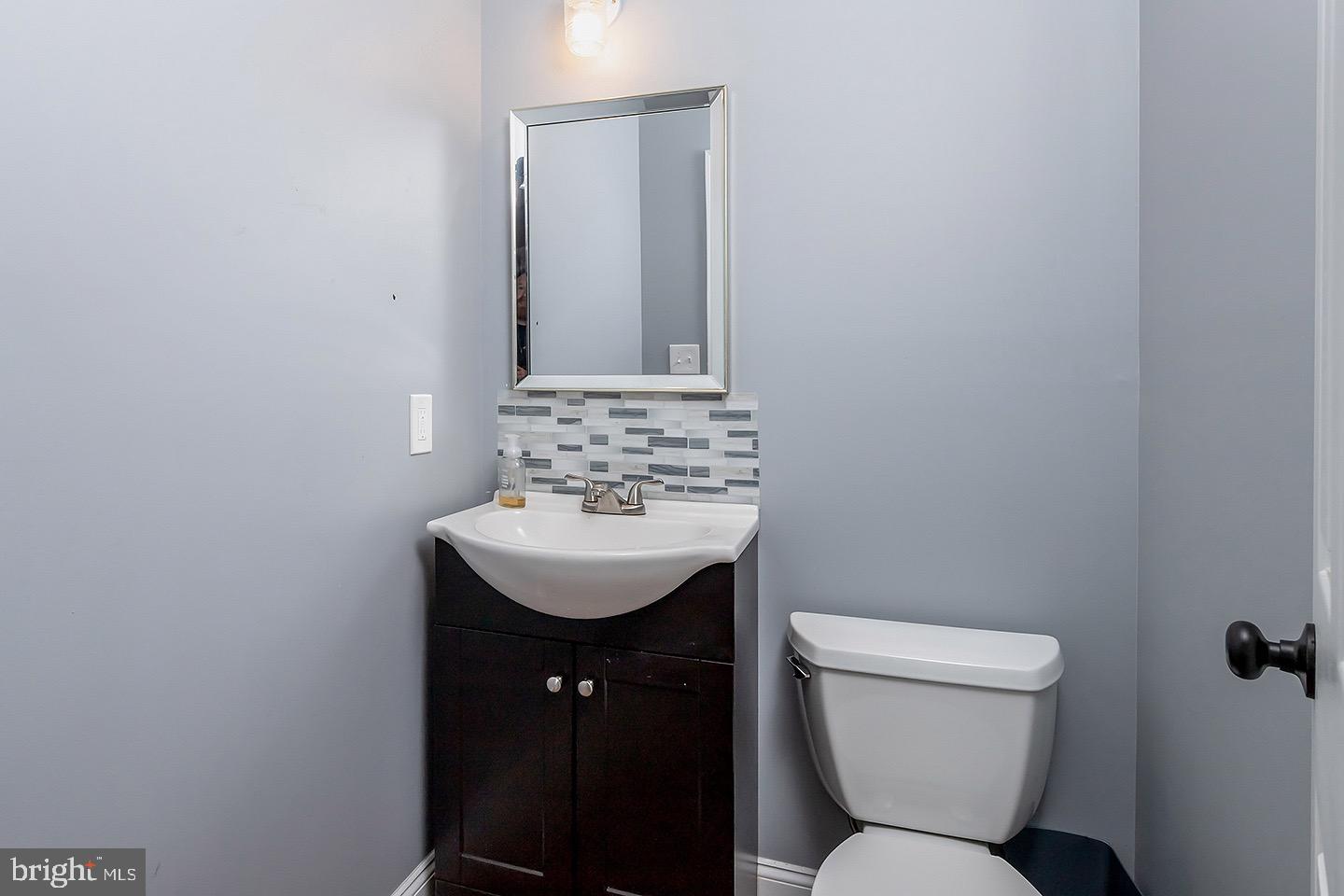 575 Allegheny Road Wenonah, NJ 08090 - Photo 20 of 23 a bathroom with a sink toilet and a mirror