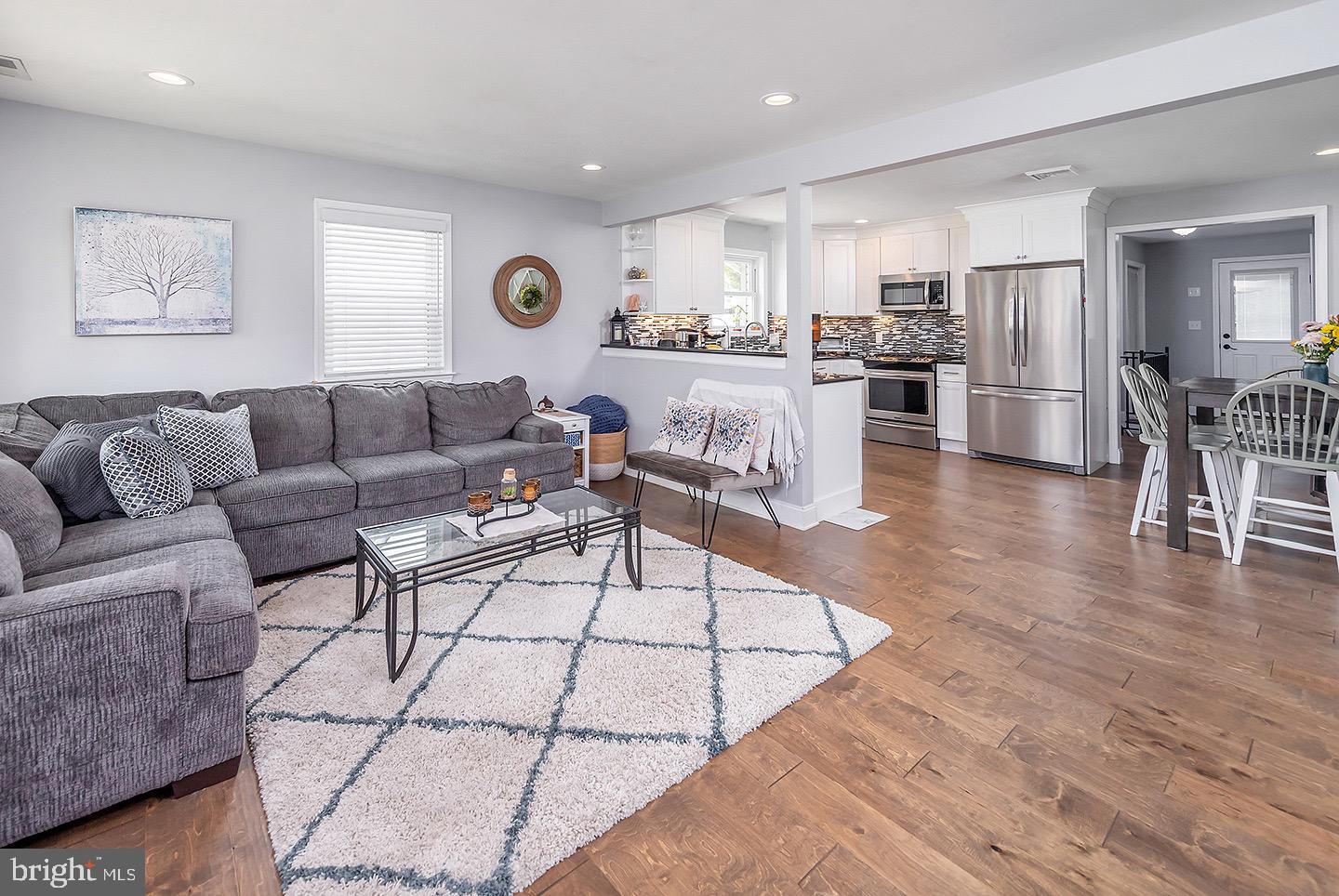 575 Allegheny Road Wenonah, NJ 08090 - Photo 3 of 23 a living room with furniture and kitchen view