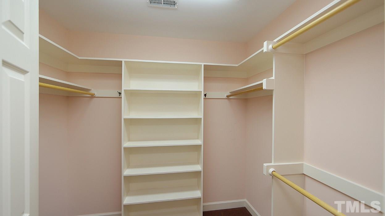 2905 Old Orchard Road Raleigh, NC 27607 - Photo 14 of 27 a view of walk in closet with empty racks