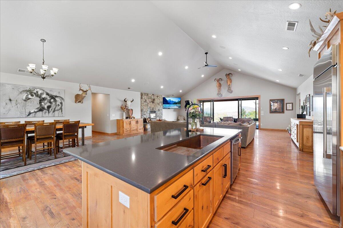 2220 Butte Falls Highway Eagle Point, OR 97524 - Photo 15 of 69 a kitchen with stainless steel appliances granite countertop a sink counter space and living room view