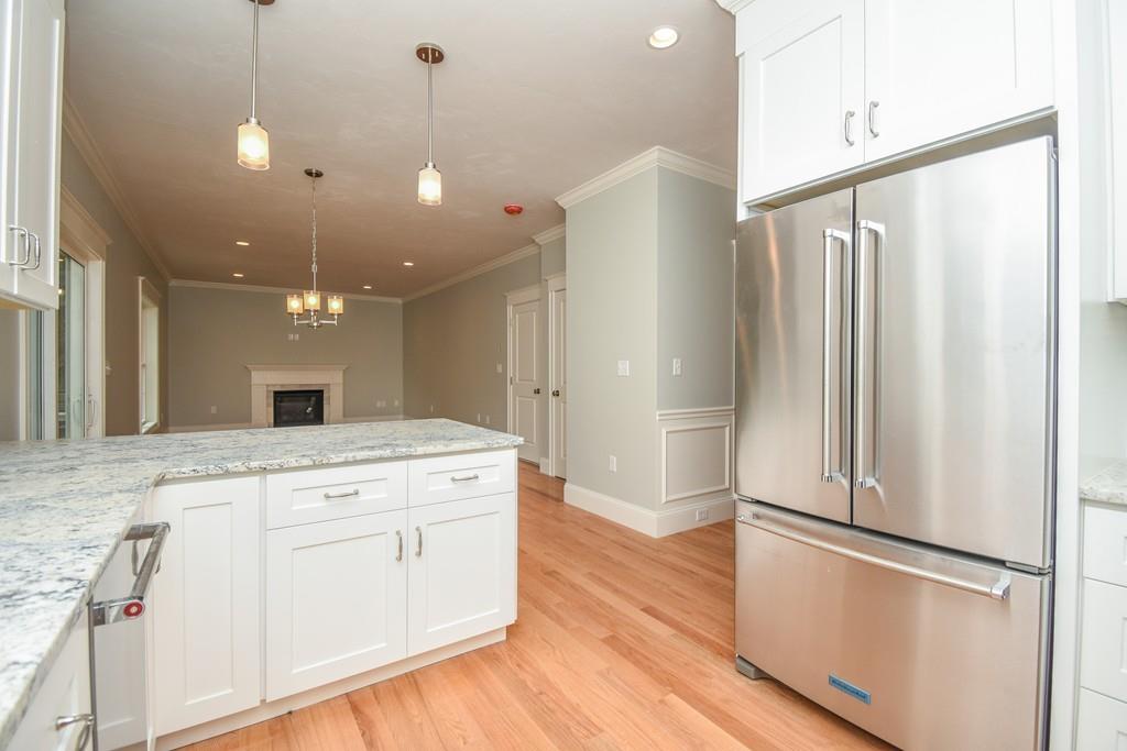 72 Bethany Road Framingham, MA 01702 - Photo 11 of 41 a open kitchen with a refrigerator a sink and a refrigerator
