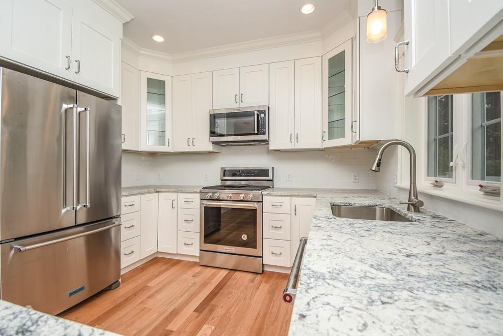 72 Bethany Road Framingham, MA 01702 - Photo 12 of 41 a kitchen with granite countertop a refrigerator stove and sink