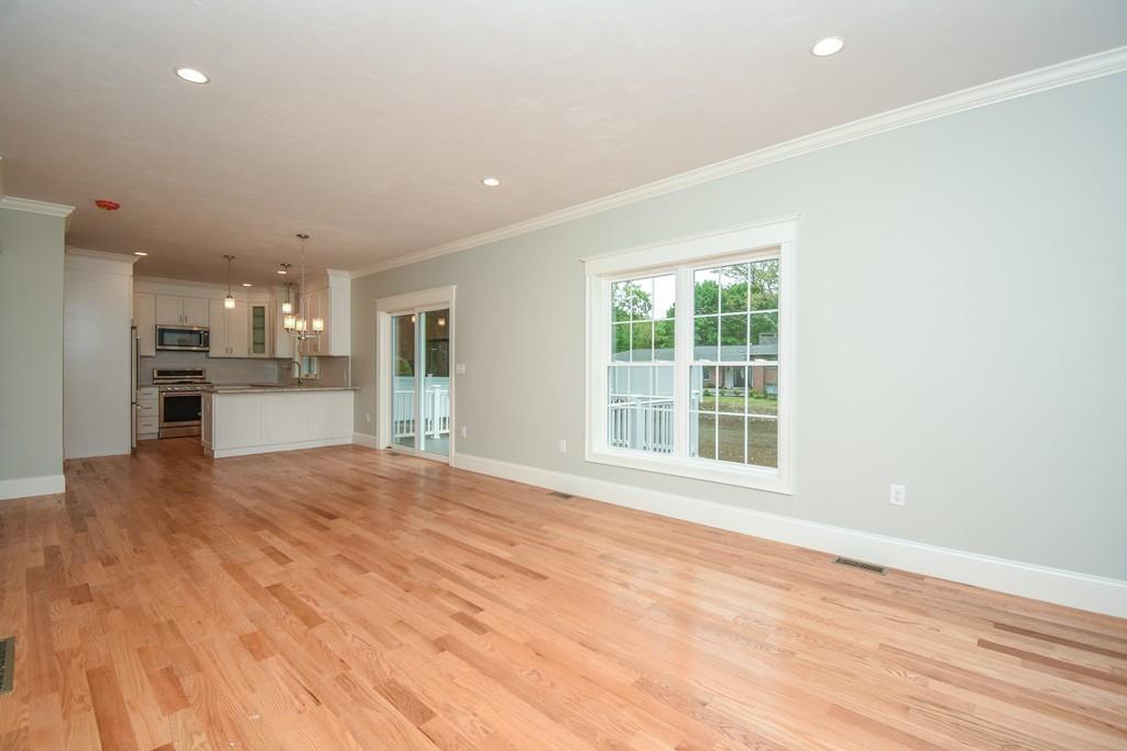 72 Bethany Road Framingham, MA 01702 - Photo 14 of 41 a view of an empty room with a window and kitchen view