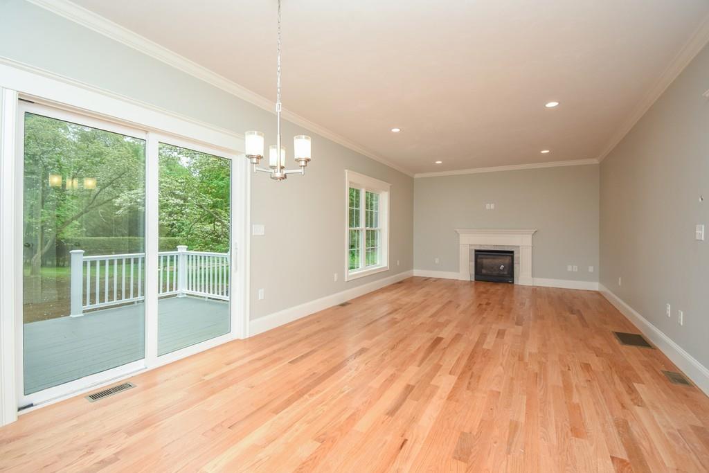 72 Bethany Road Framingham, MA 01702 - Photo 17 of 41 a view of empty room with wooden floor and fireplace