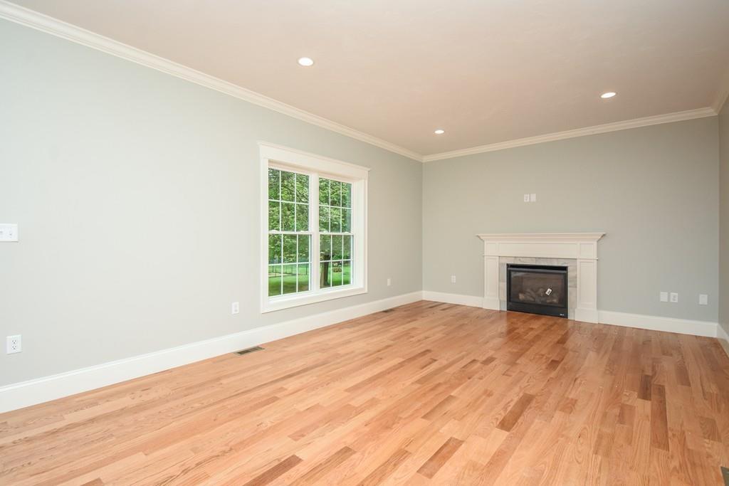 72 Bethany Road Framingham, MA 01702 - Photo 18 of 41 an empty room with windows and a fireplace