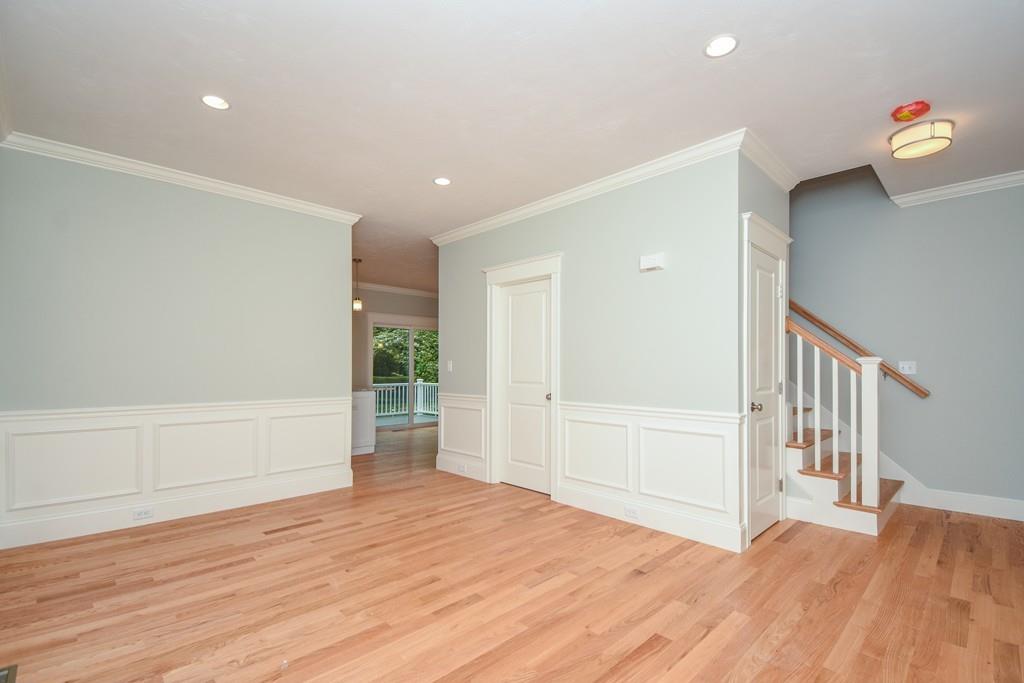 72 Bethany Road Framingham, MA 01702 - Photo 20 of 41 a view of an empty room with wooden floor and entryway