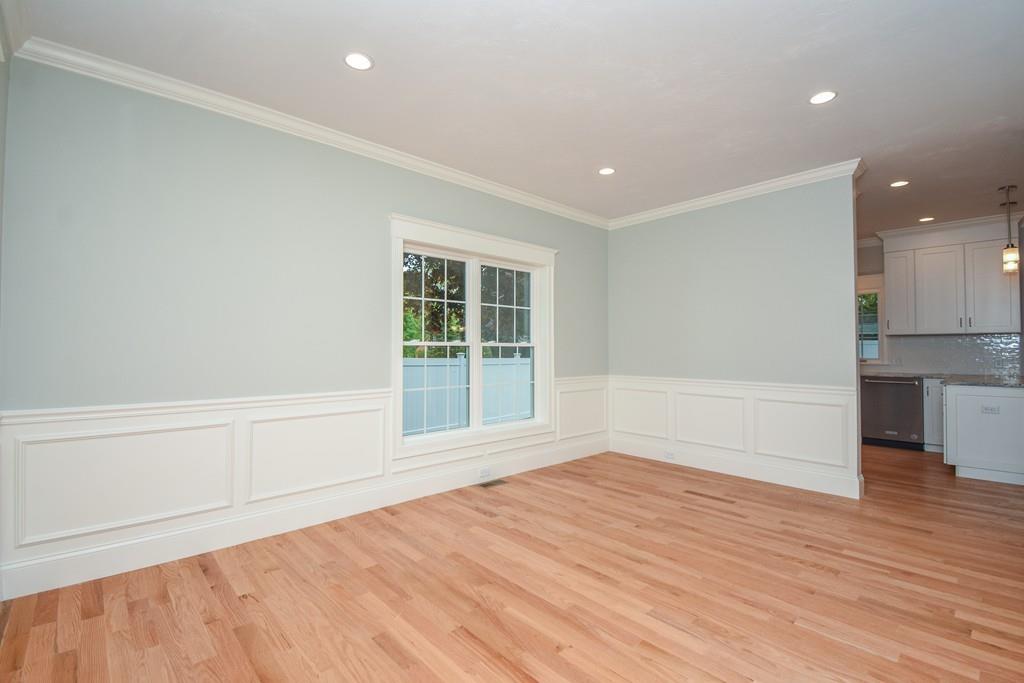 72 Bethany Road Framingham, MA 01702 - Photo 21 of 41 an empty room with wooden floor and windows