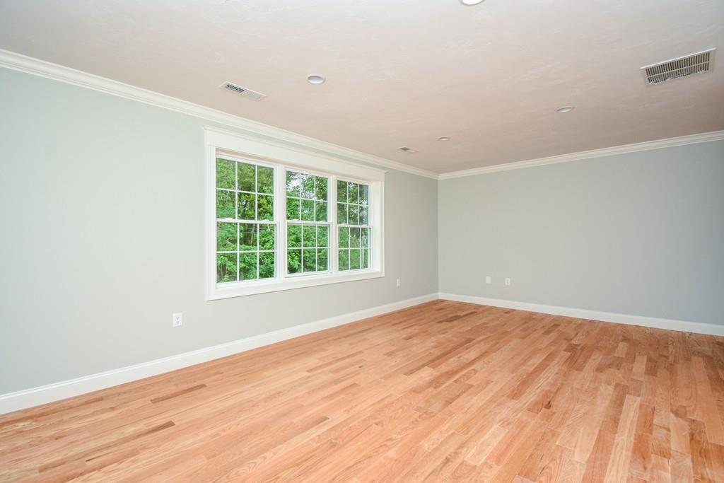 72 Bethany Road Framingham, MA 01702 - Photo 31 of 41 a view of an empty room with wooden floor and a window