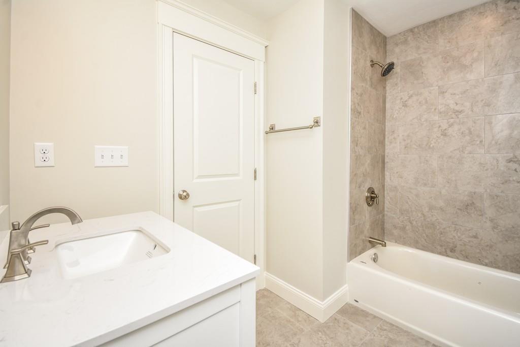 72 Bethany Road Framingham, MA 01702 - Photo 36 of 41 a bathroom with a sink and a bathtub