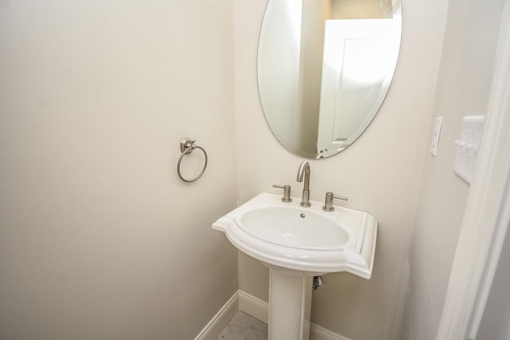 72 Bethany Road Framingham, MA 01702 - Photo 40 of 41 a bathroom with a sink a mirror and a shower