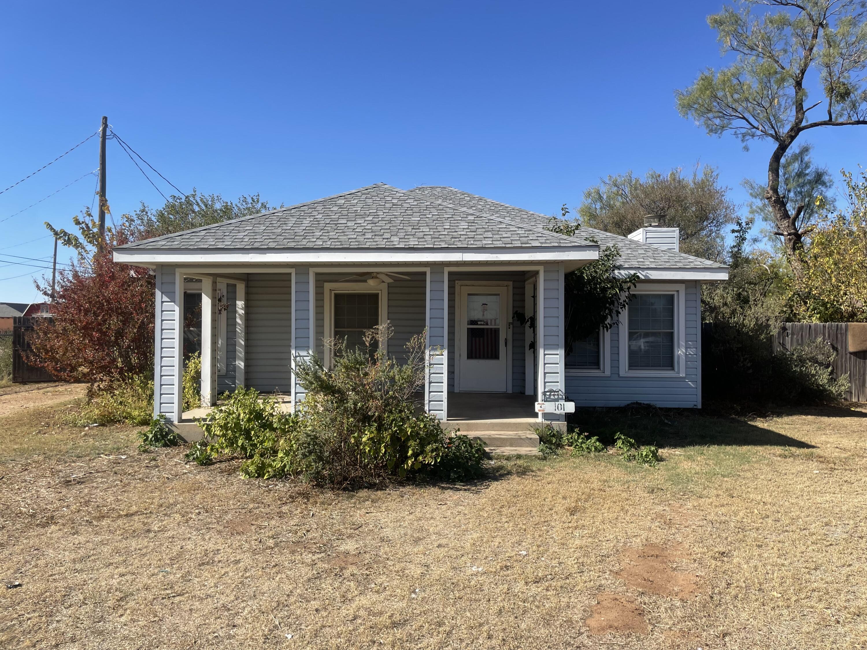 101 S Avenue Post, TX 79356 - Photo 1 of 19 a front view of a house with garden