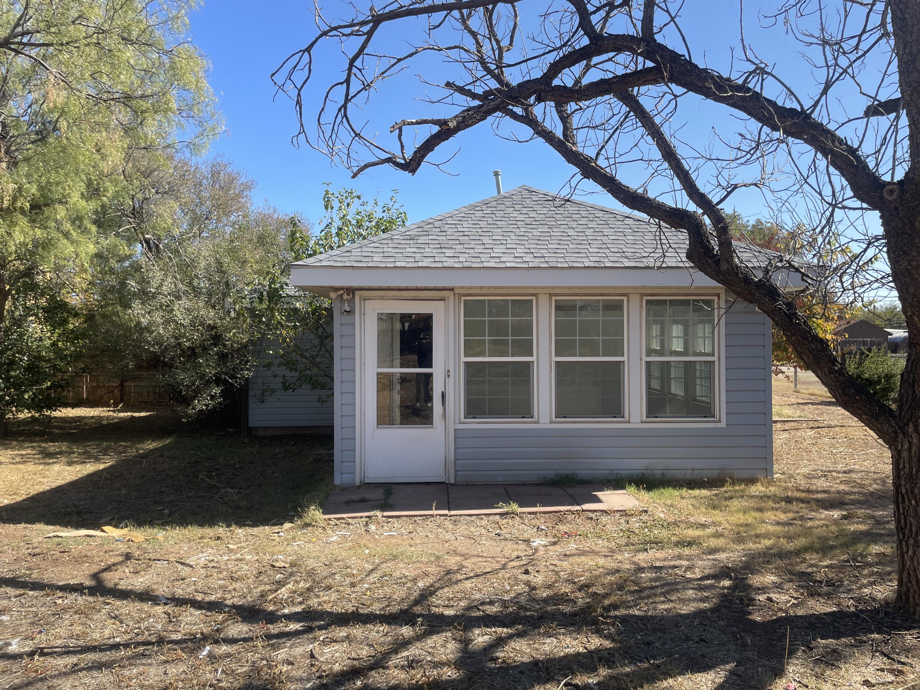 101 S Avenue Post, TX 79356 - Photo 12 of 19 a house that has a tree in front of it