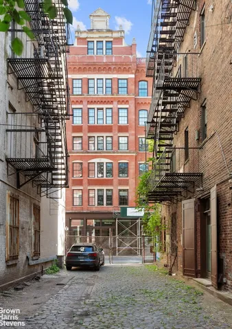 a view of a pathway with a yard