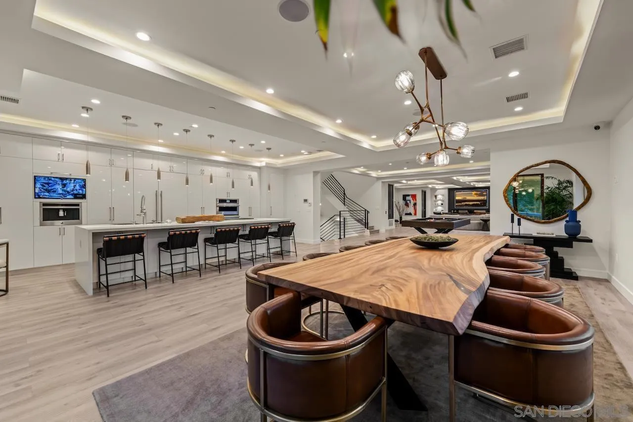 3820 Knobhill Drive Sherman Oaks, CA 91423 - Photo 20 of 75 a room with stainless steel appliances kitchen island a table and chairs