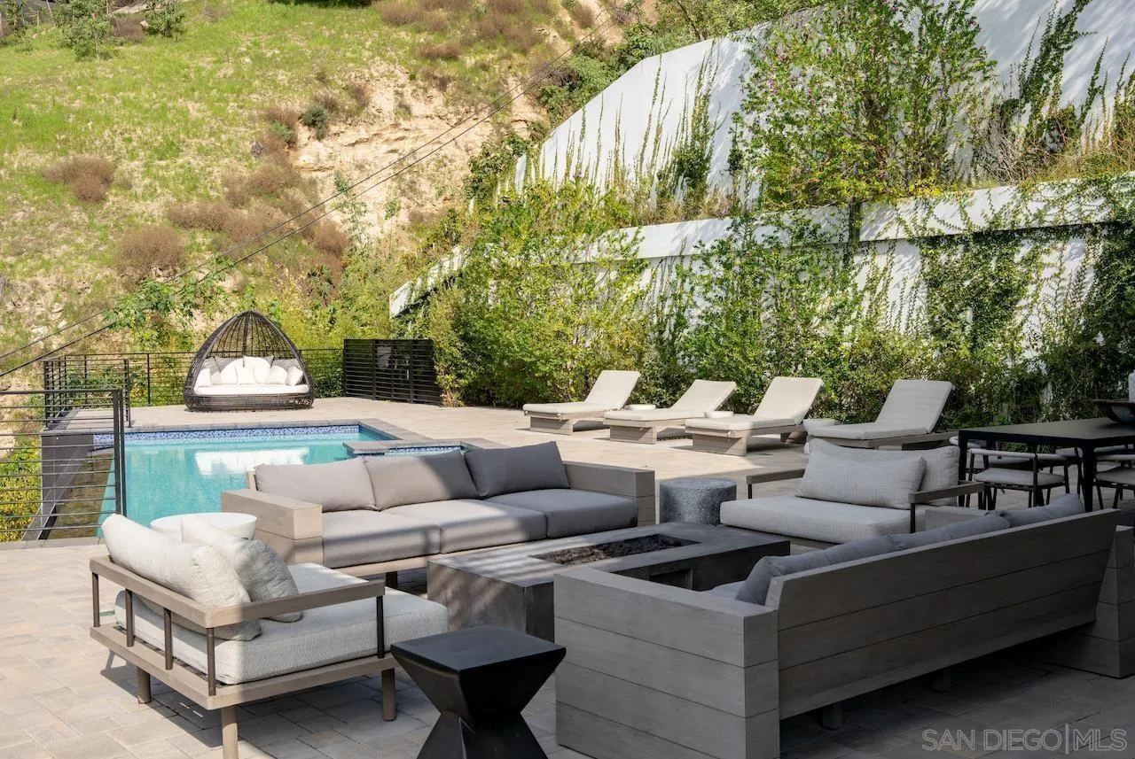 3820 Knobhill Drive Sherman Oaks, CA 91423 - Photo 22 of 75 a view of a patio with couches table and chairs and potted plants
