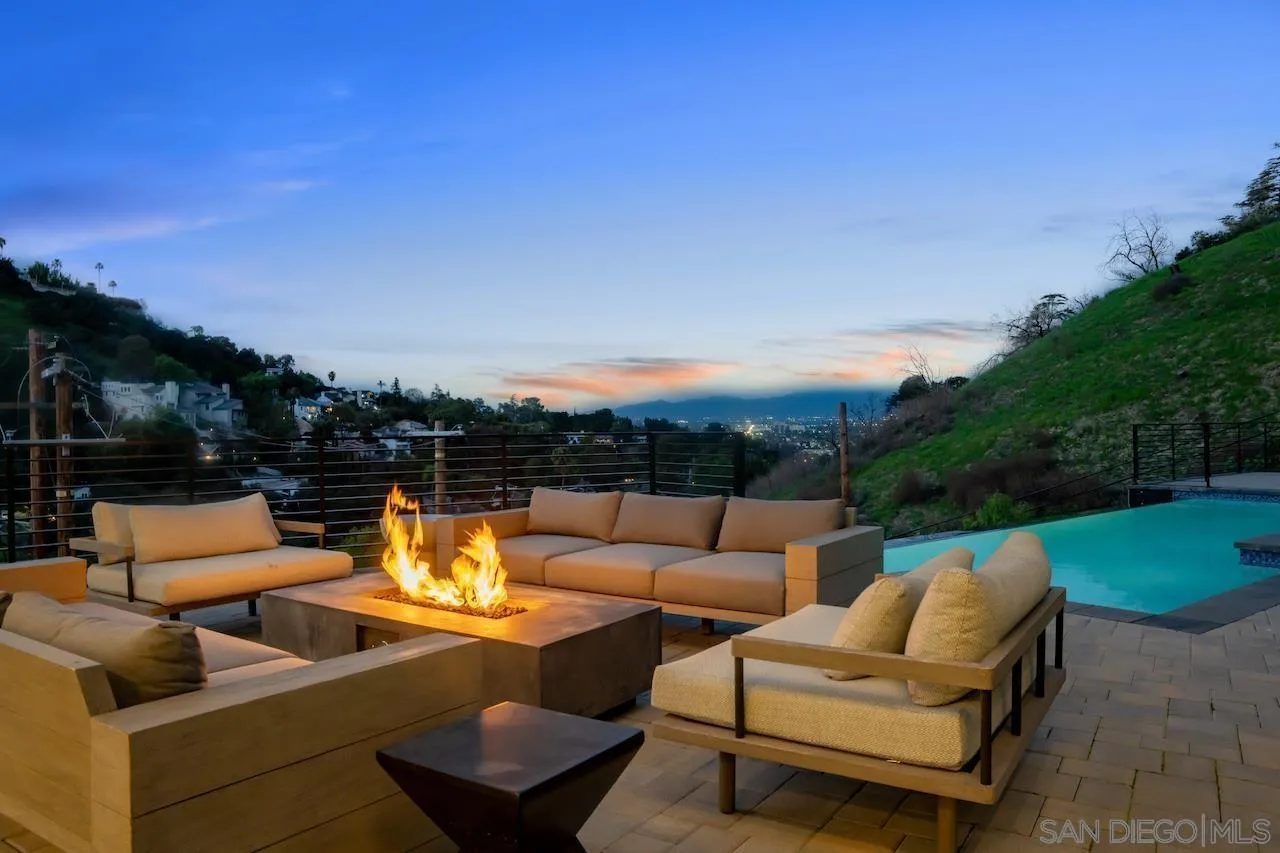 3820 Knobhill Drive Sherman Oaks, CA 91423 - Photo 25 of 75 a view of a patio with couches and a table and chairs with wooden fence