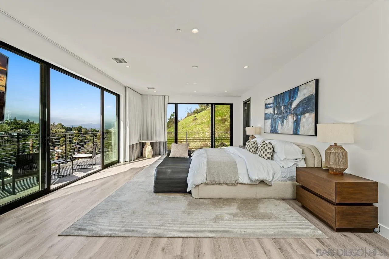 3820 Knobhill Drive Sherman Oaks, CA 91423 - Photo 30 of 75 a spacious bedroom with a large bed and a large window