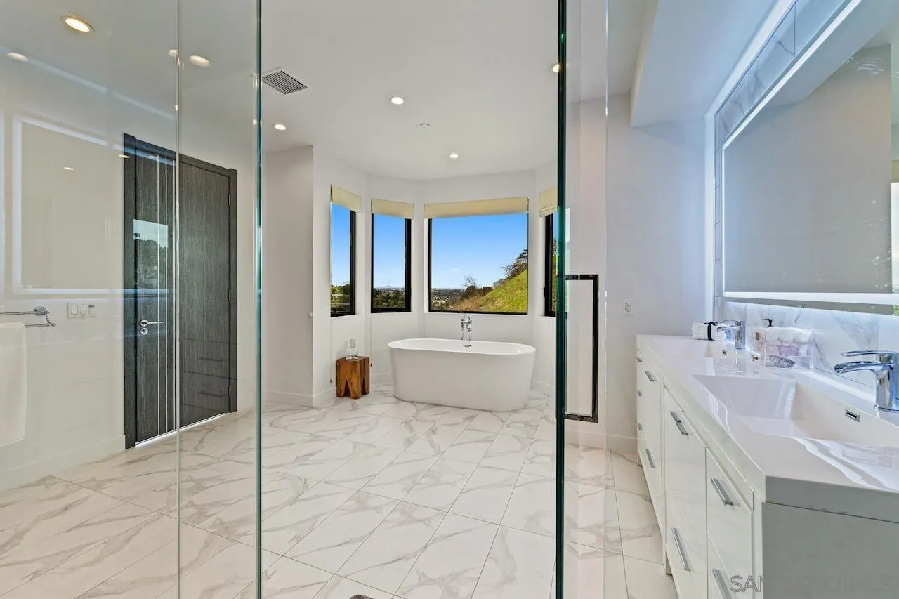 3820 Knobhill Drive Sherman Oaks, CA 91423 - Photo 36 of 75 a bathroom with a tub sink and mirror