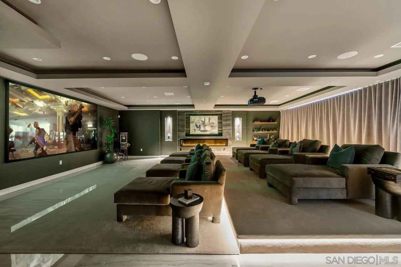 3820 Knobhill Drive Sherman Oaks, CA 91423 - Photo 42 of 75 a living room with furniture a projector and flat screen