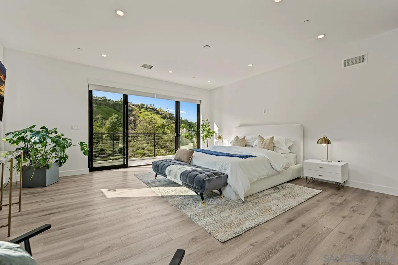 3820 Knobhill Drive Sherman Oaks, CA 91423 - Photo 48 of 75 a spacious bedroom with a large bed and a large window