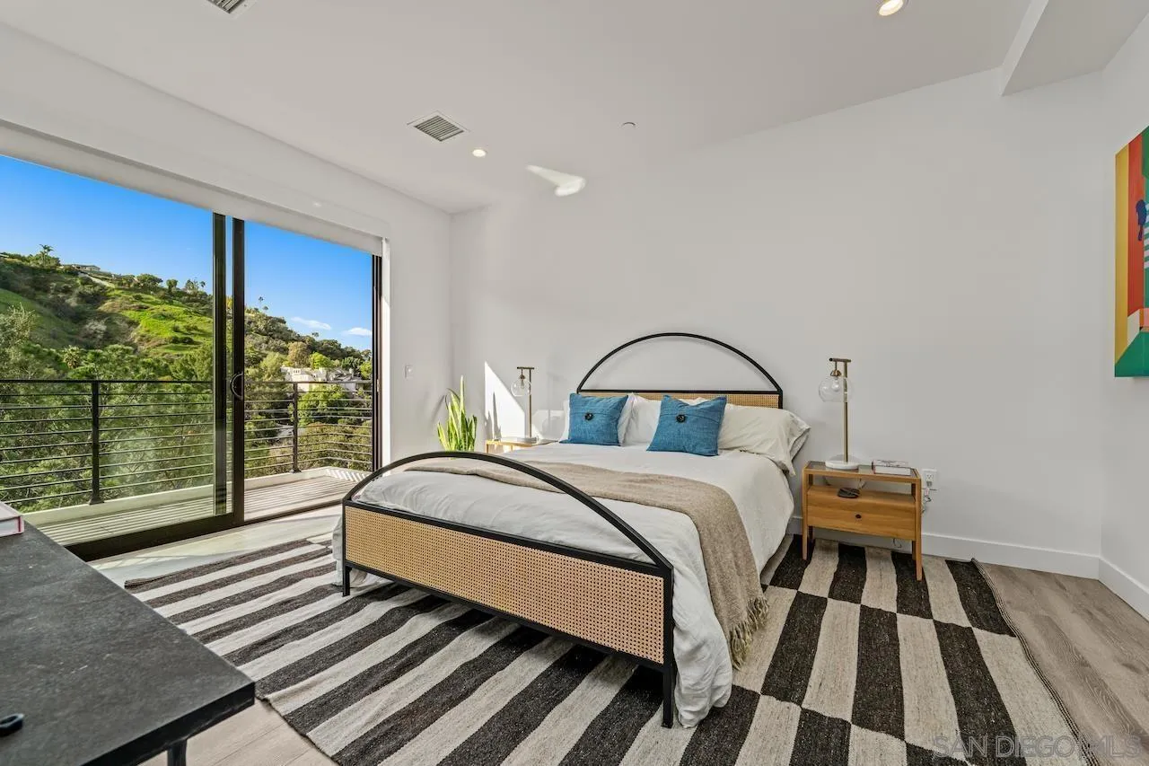 3820 Knobhill Drive Sherman Oaks, CA 91423 - Photo 55 of 75 a bedroom with a bed and wooden floor