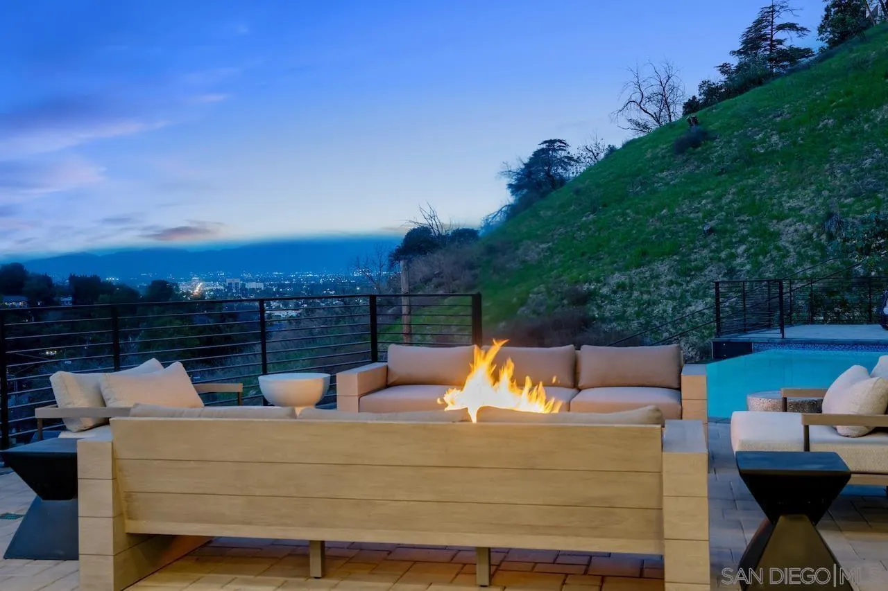 3820 Knobhill Drive Sherman Oaks, CA 91423 - Photo 66 of 75 a view of a roof deck with couches and wooden floor