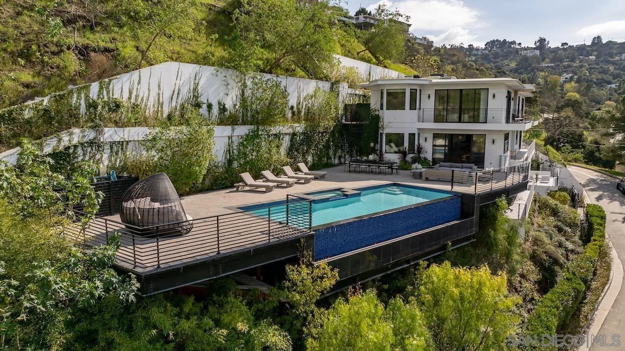 3820 Knobhill Drive Sherman Oaks, CA 91423 - Photo 70 of 75 a wooden bench sitting in front of a house