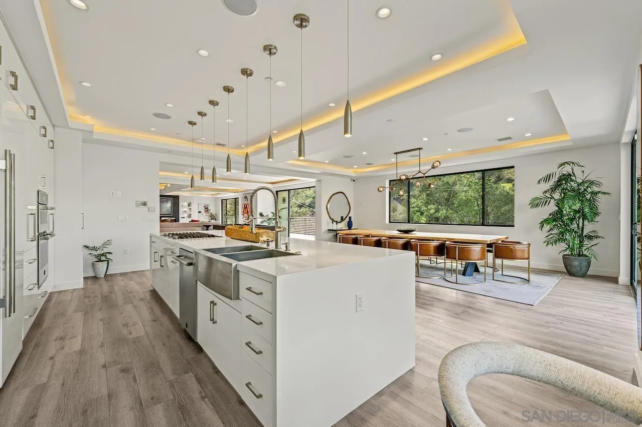 3820 Knobhill Drive Sherman Oaks, CA 91423 - Photo 7 of 75 a open kitchen with stainless steel appliances granite countertop a lot of counter space and a couch