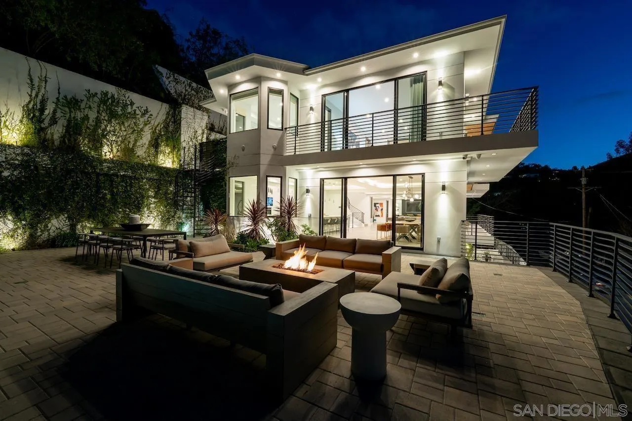 3820 Knobhill Drive Sherman Oaks, CA 91423 - Photo 72 of 75 a view of a patio with couches table and chairs and potted plants