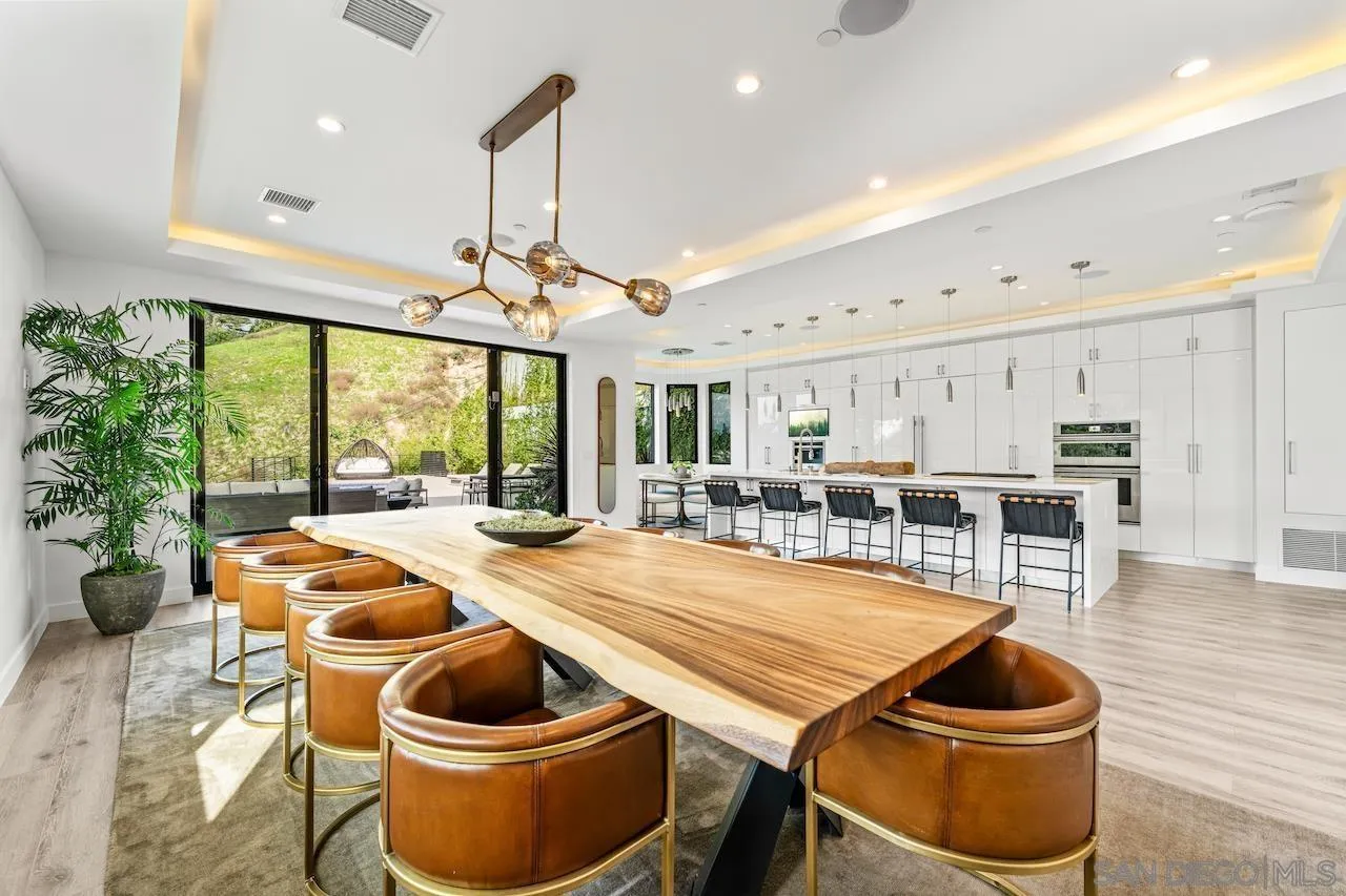 3820 Knobhill Drive Sherman Oaks, CA 91423 - Photo 9 of 75 a room with stainless steel appliances granite countertop a table chairs and a kitchen view
