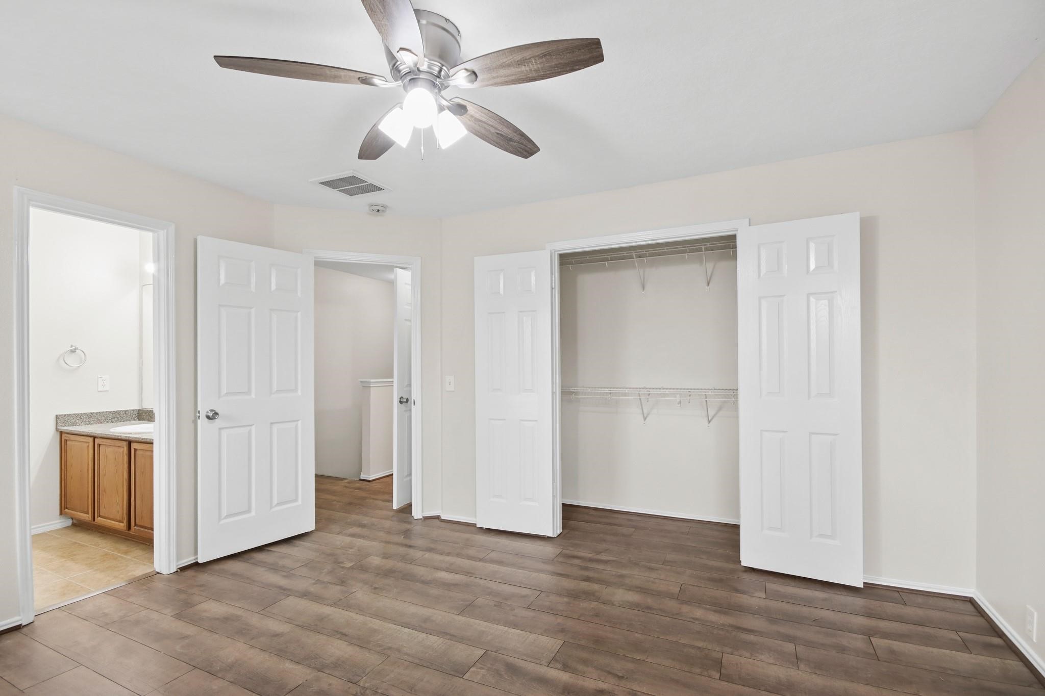 3526 Glenmore Meadow Drive Spring, TX 77386 - Photo 14 of 23 a view of an empty room with wooden floor