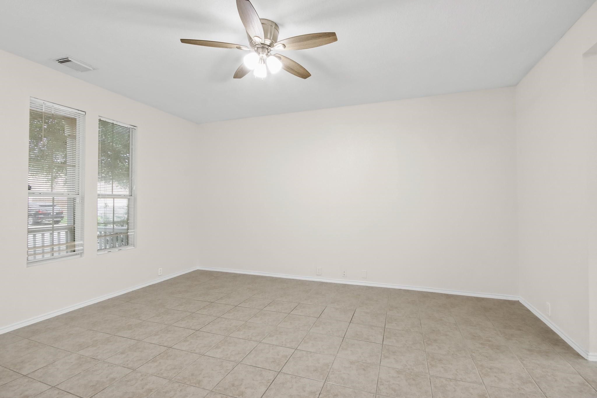 3526 Glenmore Meadow Drive Spring, TX 77386 - Photo 4 of 23 an empty room with windows and fan