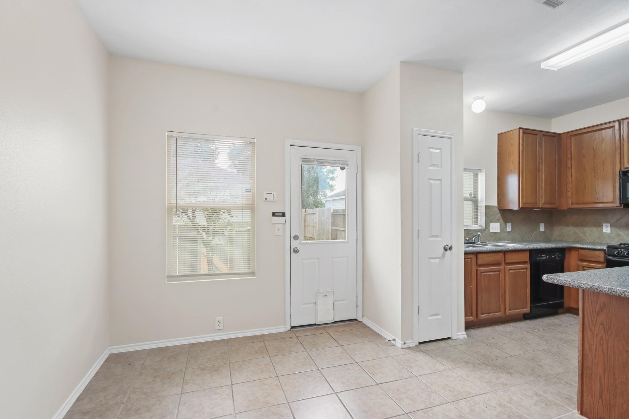 3526 Glenmore Meadow Drive Spring, TX 77386 - Photo 8 of 23 a view of a kitchen with kitchen island granite countertop wooden cabinets and stainless steel appliances