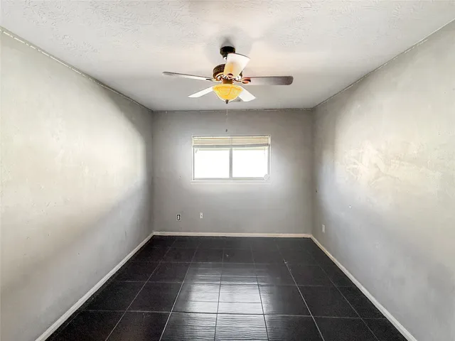 a view of a room with a air conditioner and windows