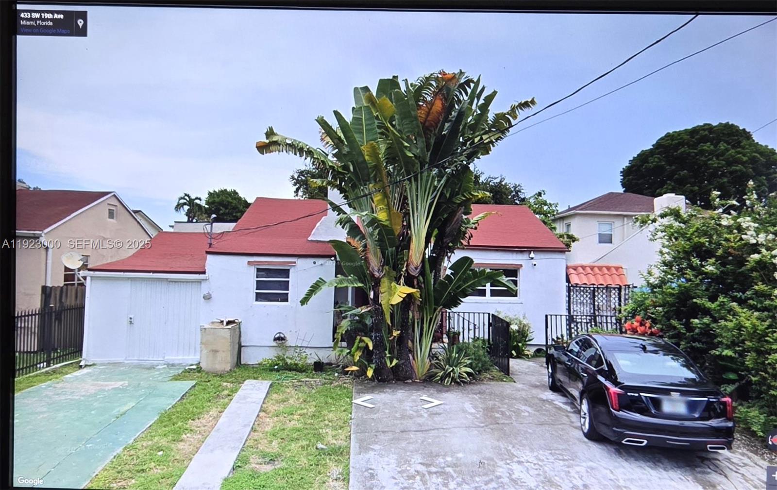 433 Southwest 19th Avenue Miami, FL 33135 - Photo 1 of 1 a front view of a house with garden