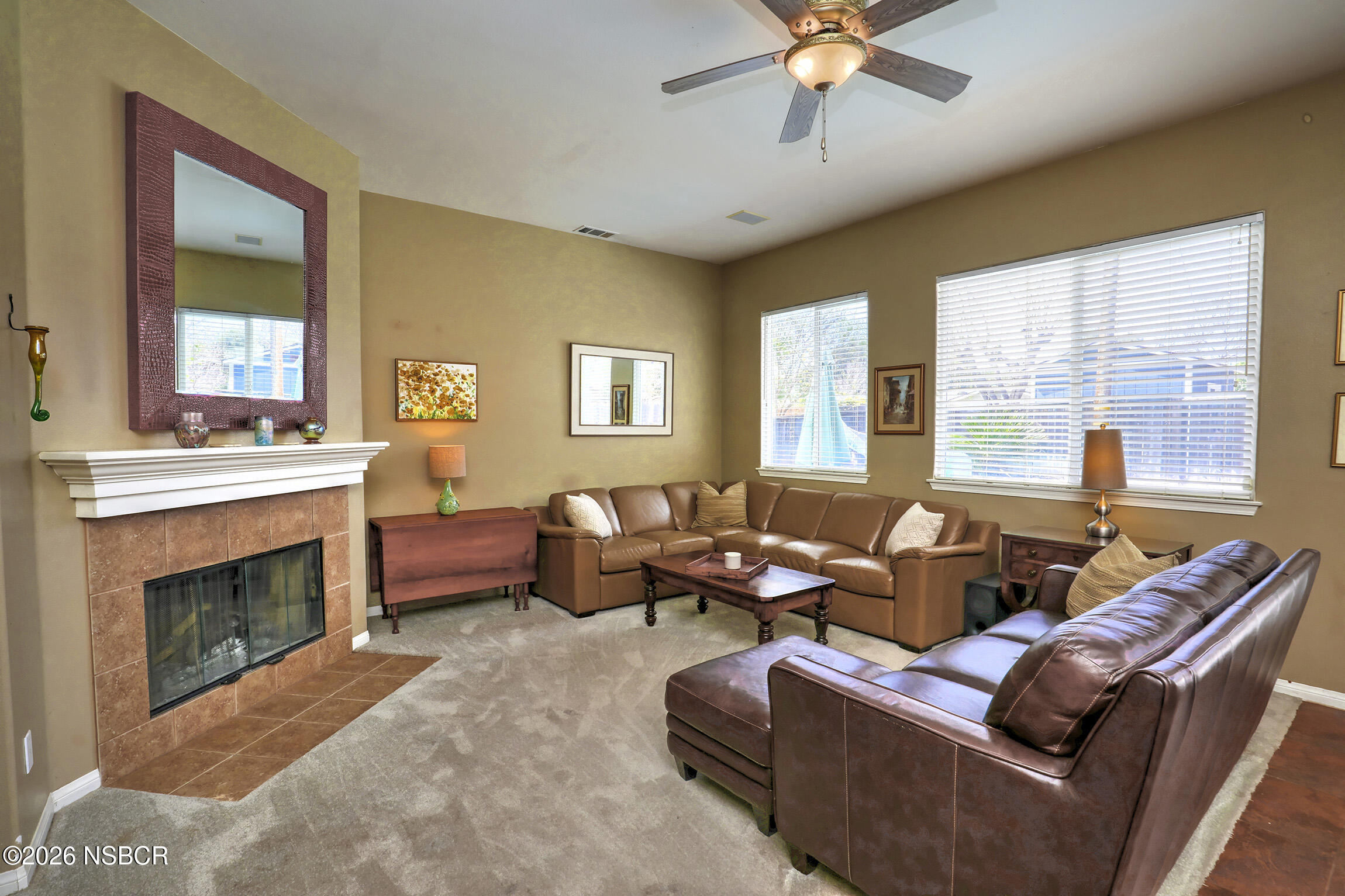 363 Quail Run Road Buellton, CA 93427 - Photo 9 of 25 a living room with furniture a fireplace and a large window