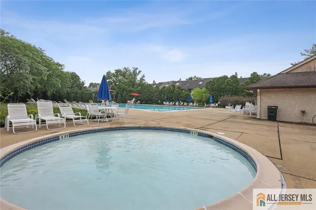 a view of a swimming pool with a patio